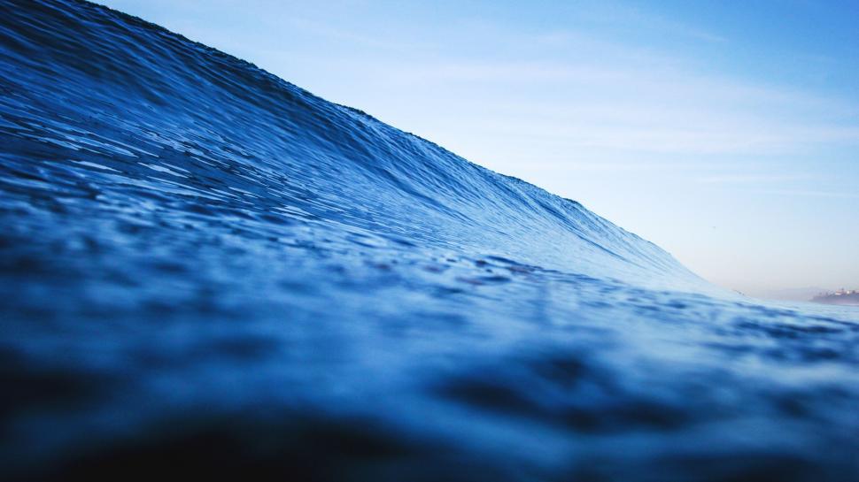 Free Image of Man Riding Wave on Surfboard 