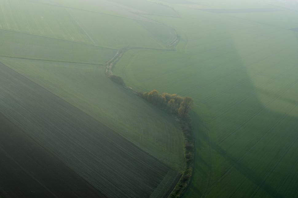 Free Image of Foggy Landscape With Train on Tracks 