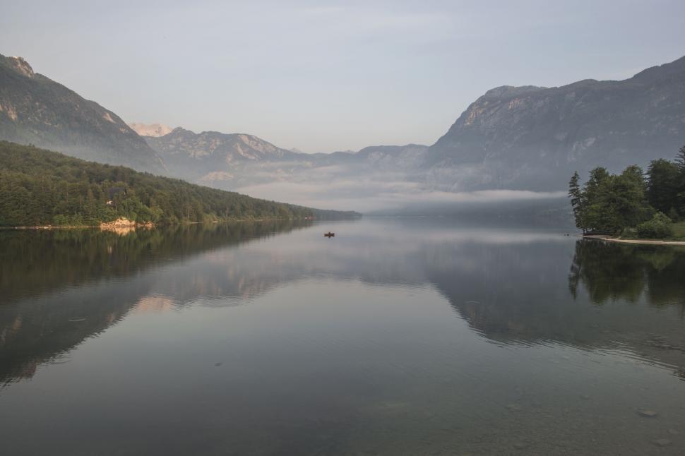 Free Image of Majestic Lake Surrounded by Towering Mountains 