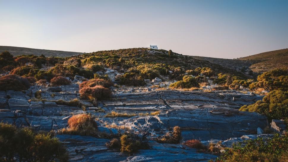 Free Image of Small House Atop Hill 