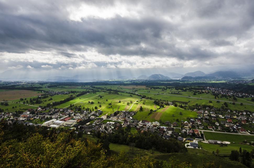 Free Image of Aerial View of Small Town Surrounded by Mountains 