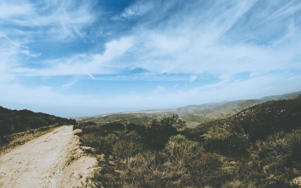 Free Image of Dirt Road Cutting Through Field 