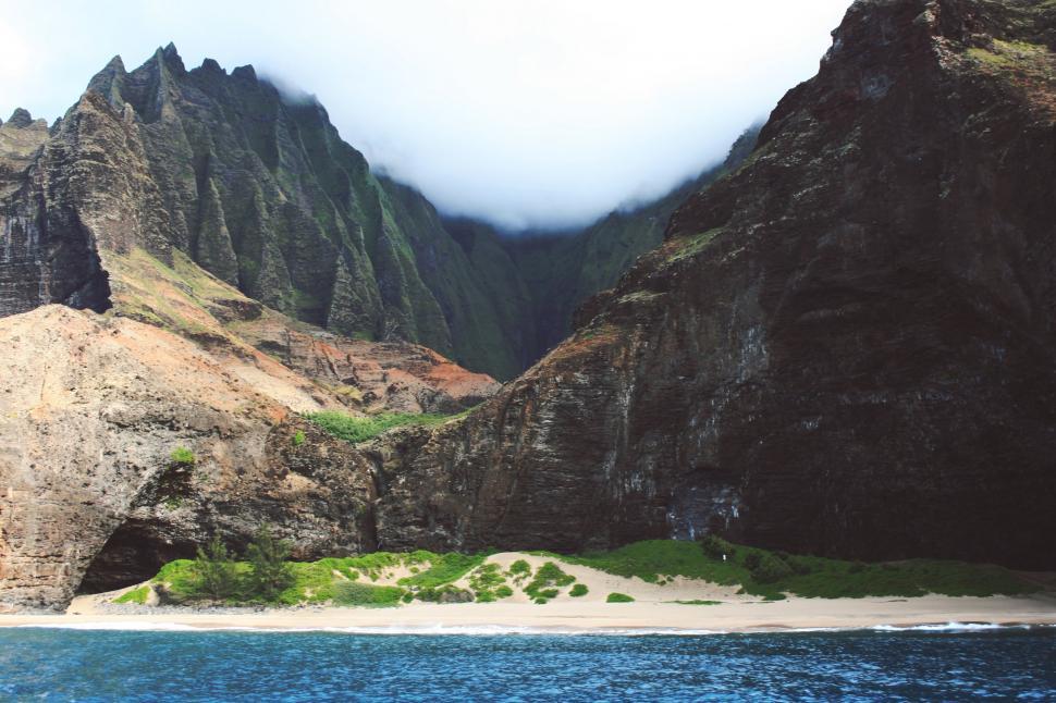 Free Image of Majestic Mountain Range Overlooking Body of Water 