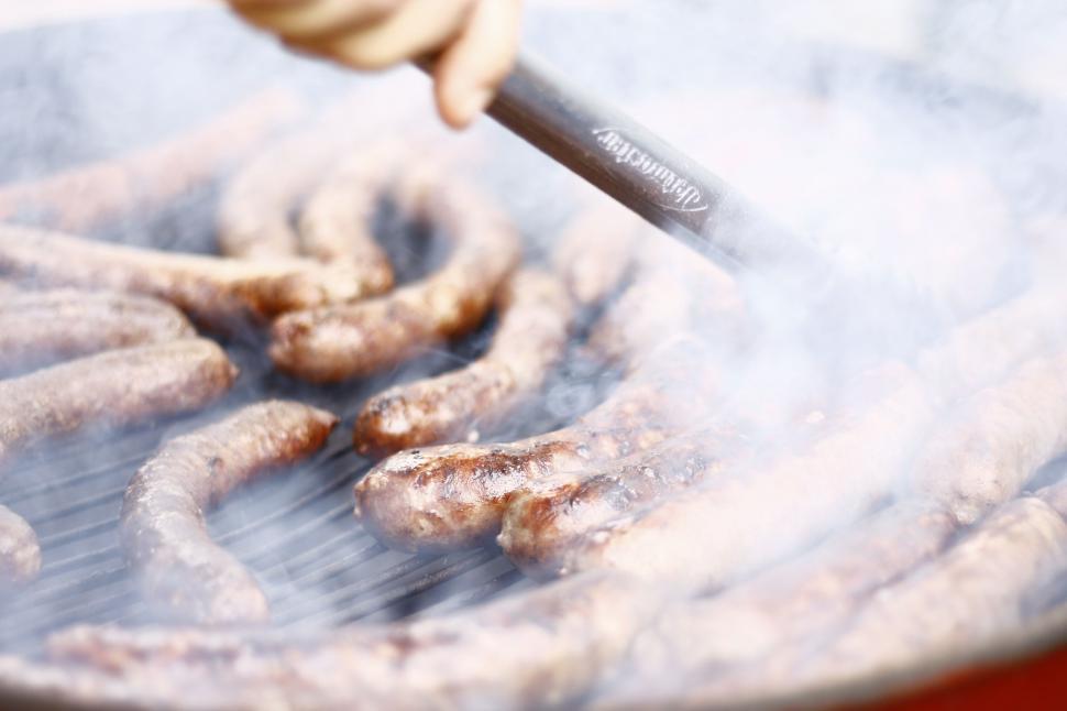 Free Image of Person Cooking Food on Grill With Spatula 