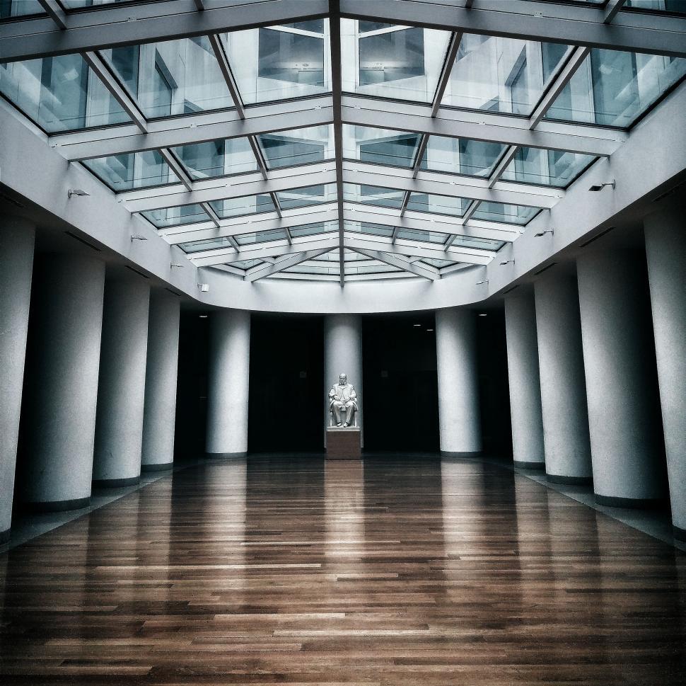 Free Image of Spacious Room With Wooden Floors and Glass Ceiling 