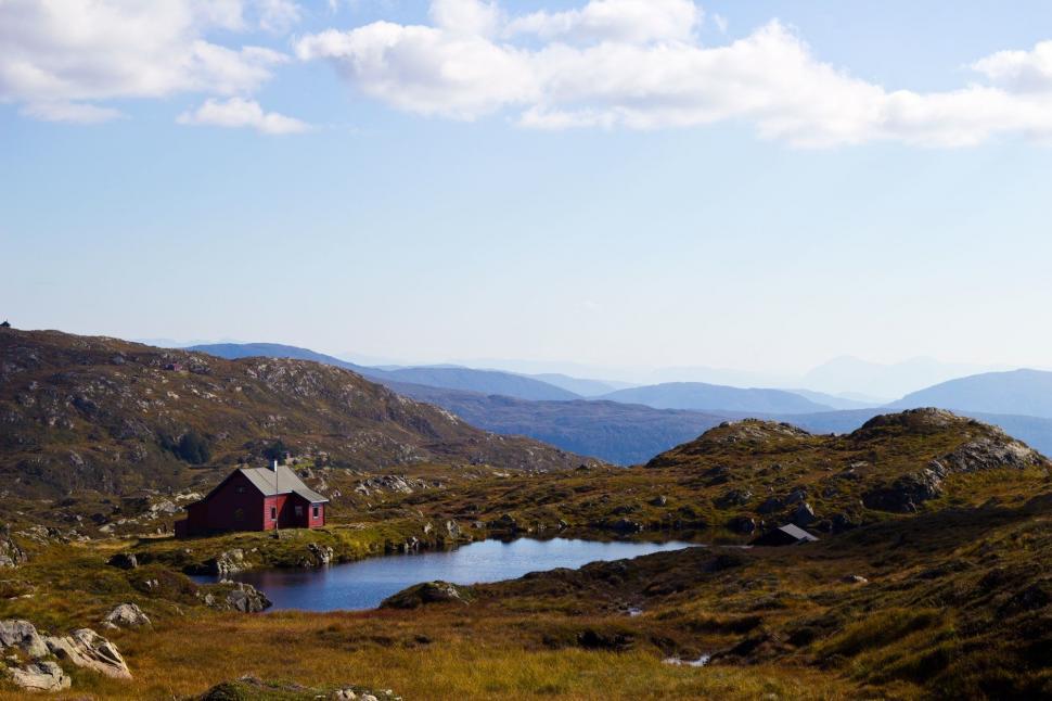 Free Image of Small House on Lush Green Hillside 