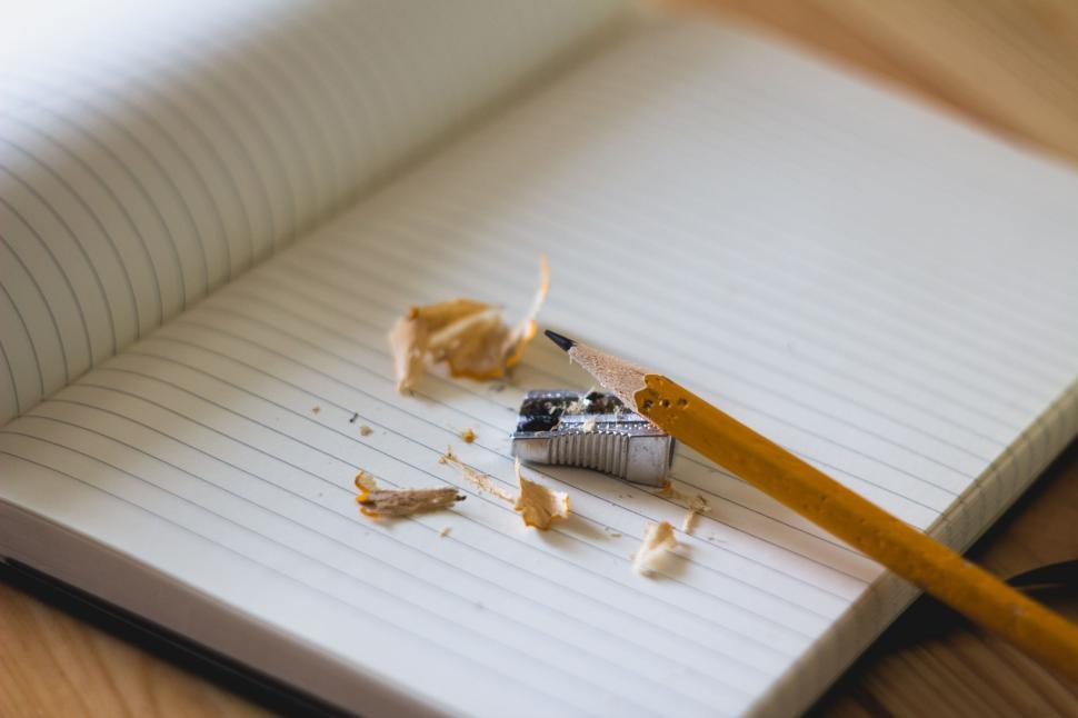Free Image of Pencil and Paper on Table 