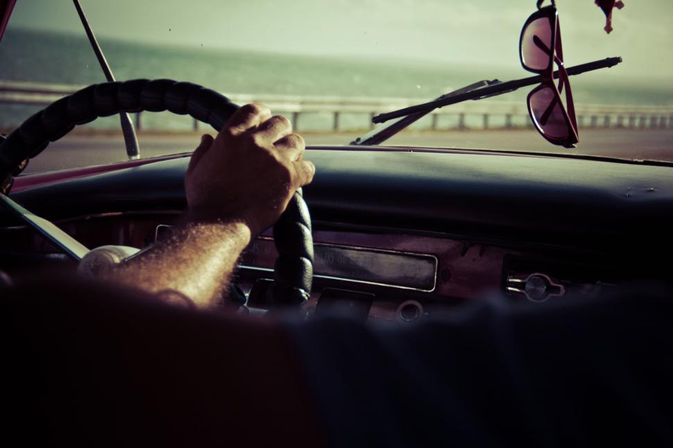 Free Image of Person Driving Car on Coastal Road 