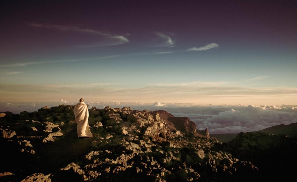 Free Image of Man Standing on Top of Rocky Mountain 