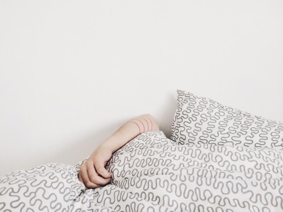 cozy-bed-with-pillow-and-blanket.jpg