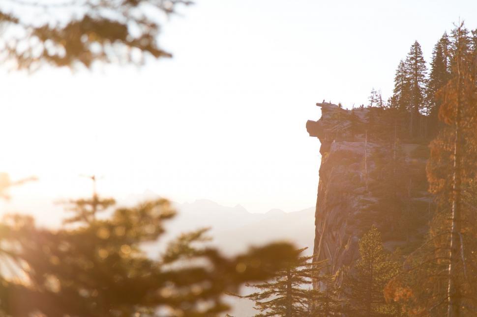Free Image of Mountain With Trees and Cliff in the Background 