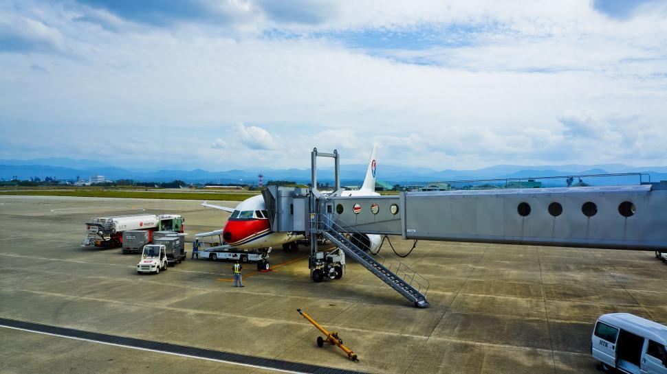 Free Image of Large Jetliner Parked on Airport Tarmac 