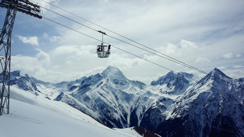 Free Image of Ski Lift Ascending Snowy Mountain 