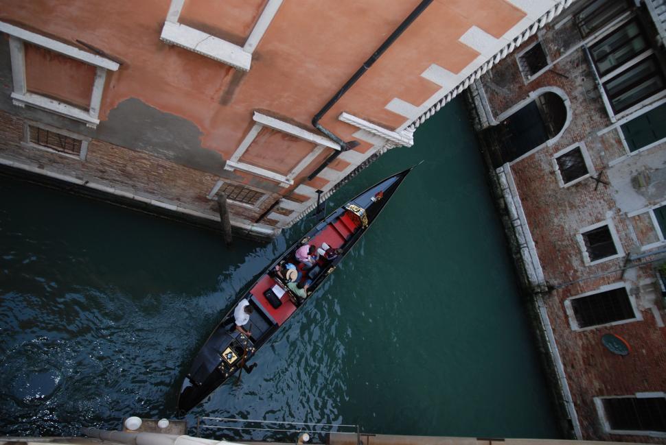 Free Image of Boat Sailing Down Canal in Venice 