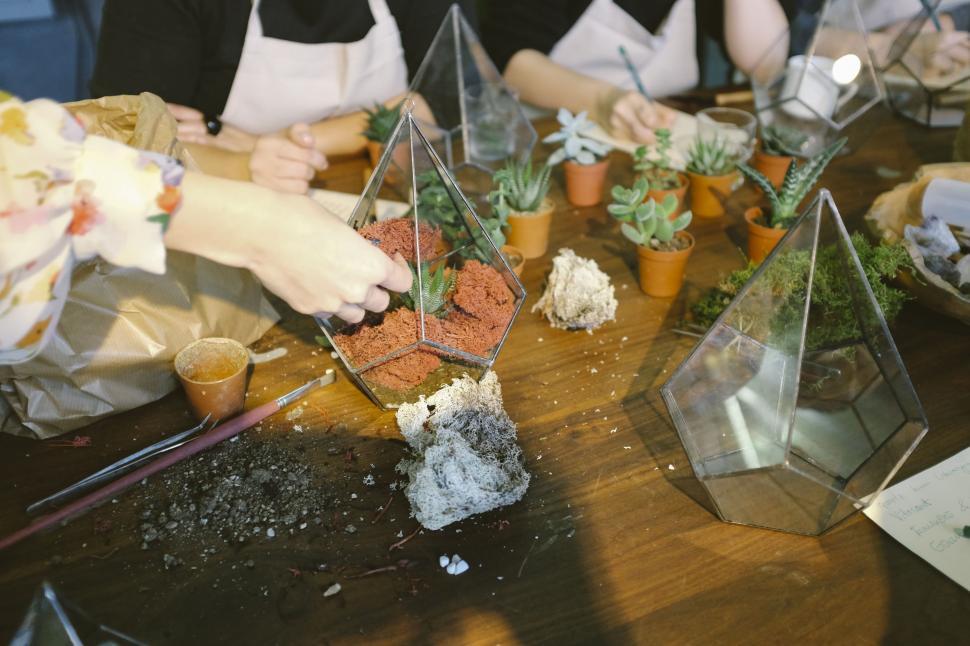 Free Image of Group of People Sitting Around a Wooden Table 