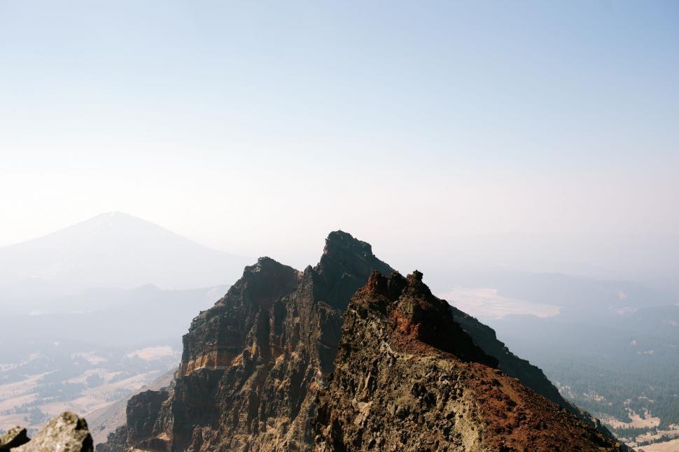 Free Image of Person Standing on Top of a Mountain 