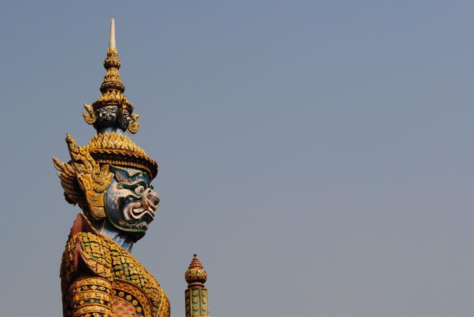 Free Image of Statue of Person With Dragon on Head 