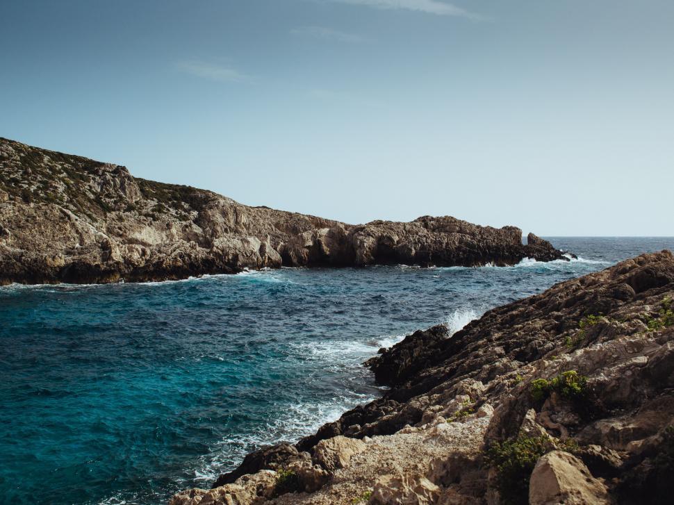 Free Image of Rocky Shoreline With Water Body 