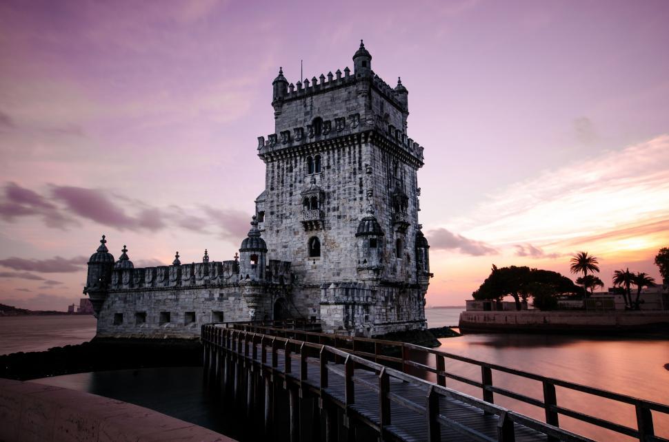 Free Image of Tower Standing Next to Water 