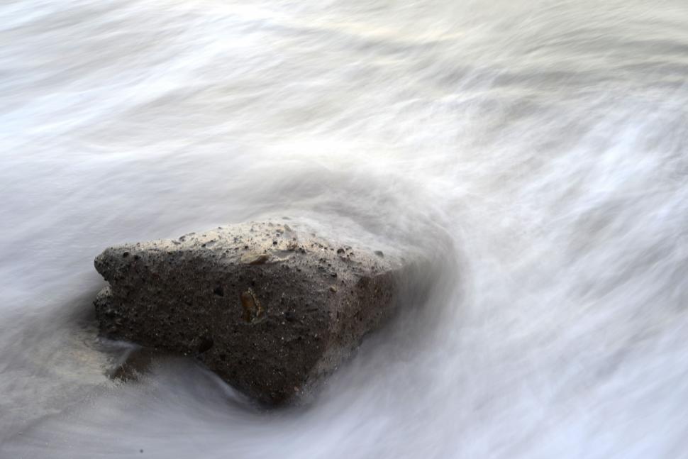 Free Image of Rock in the Middle of a Body of Water 