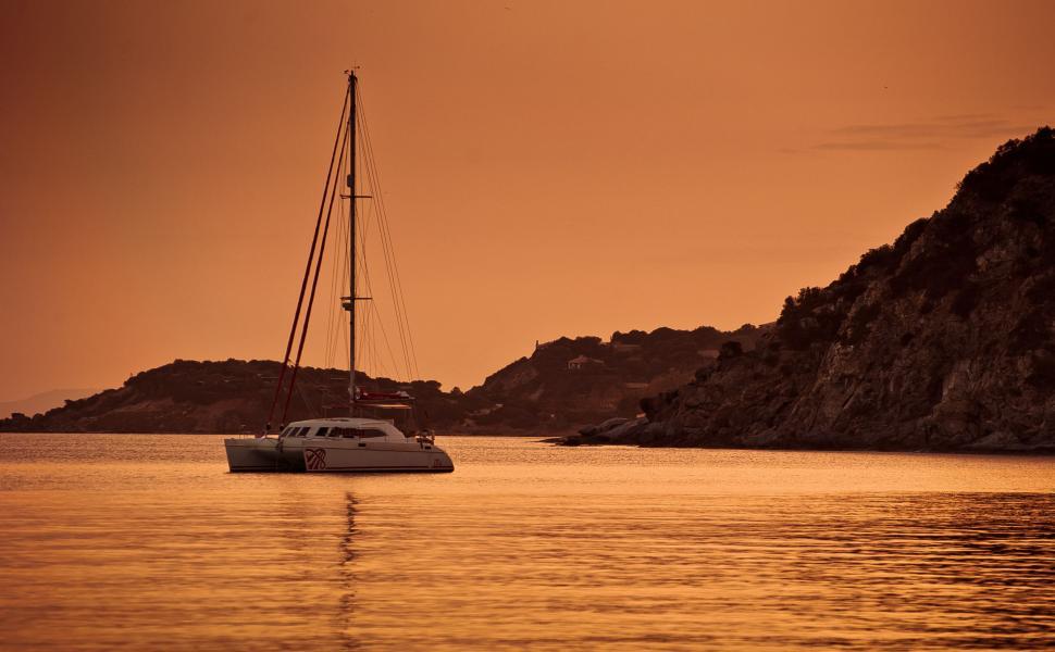 Free Image of Boat Floating on Body of Water 