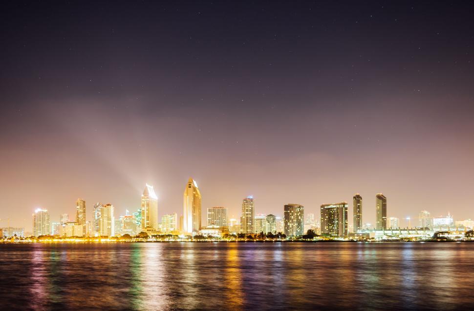 Free Image of City Skyline Reflecting on Water at Night 