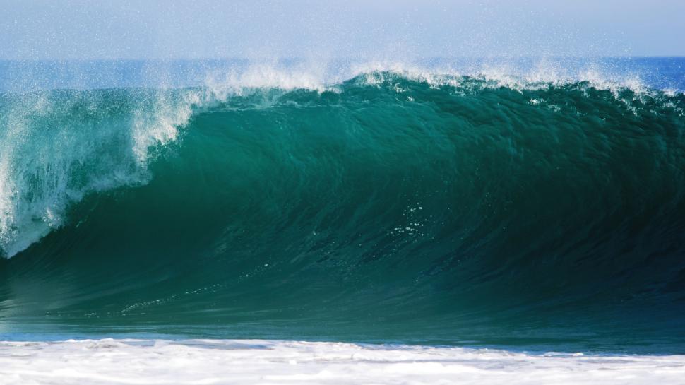 Free Image of Man Riding Wave on Surfboard 