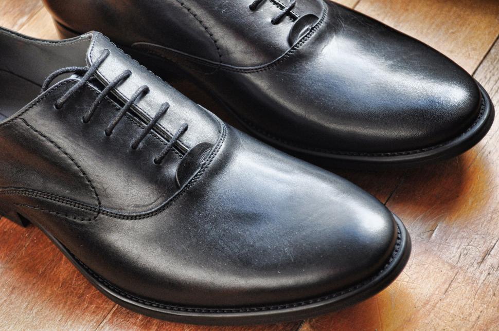 Free Image of Black Shoes on Wooden Floor 