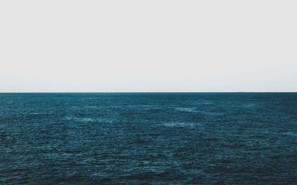 Free Image of Boat Sailing Across Vast Water 