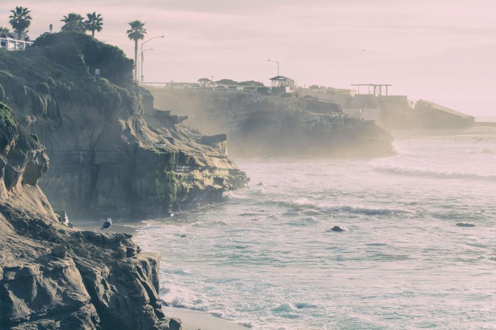 Free Image of Person Standing on Cliff Near Ocean 
