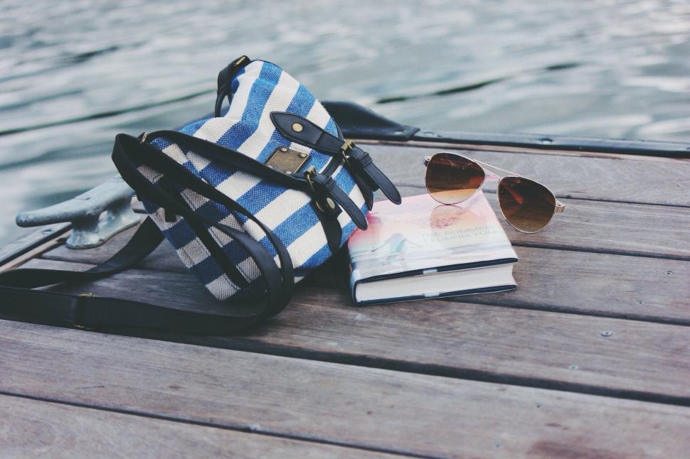 Free Image of Blue and White Striped Bag on Wooden Dock 
