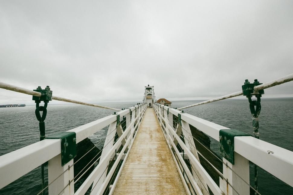 Free Image of Boat Traveling Across Vast Body of Water 