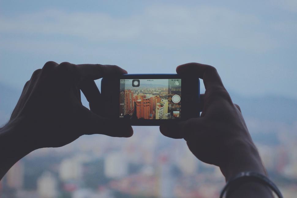 person-taking-a-picture-with-a-cell-phone.jpg