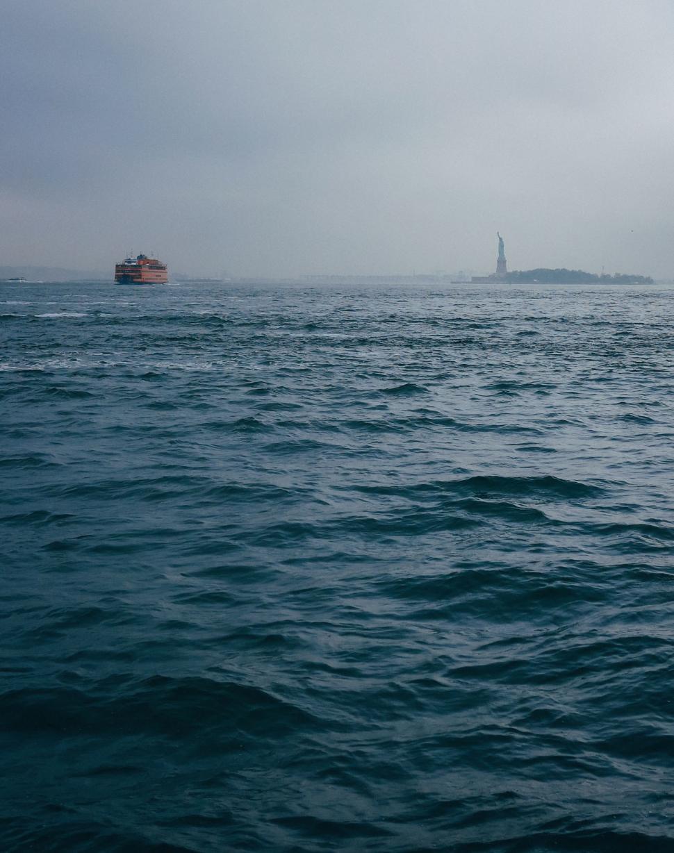 Free Image of Lighthouse Overlooking Vast Body of Water 