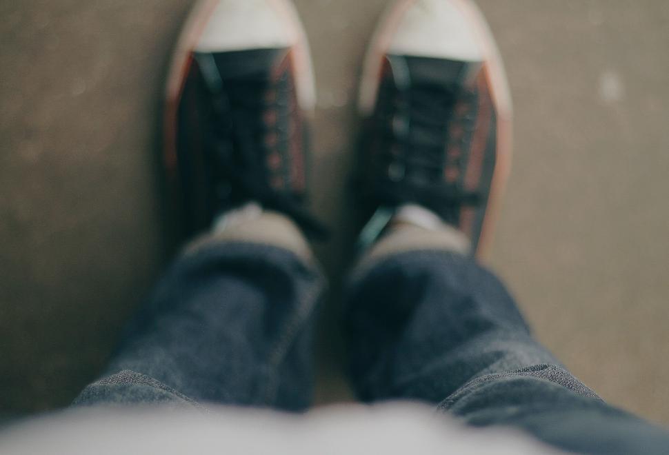 Free Image of Persons Feet in Black and White Shoes 