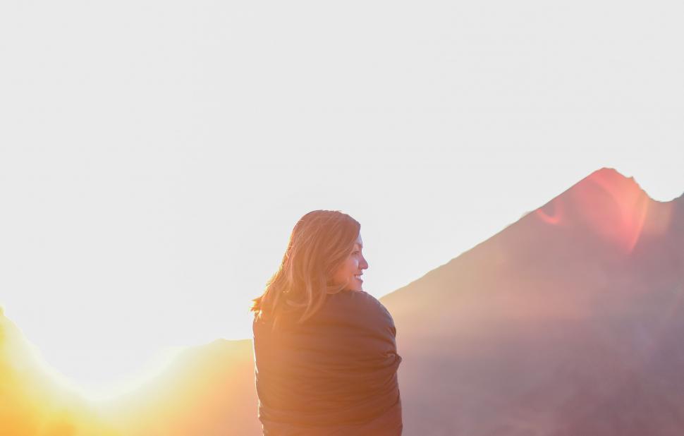 Free Image of Woman Standing on Top of Snow Covered Slope 