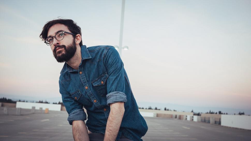 Free Image of Man Riding Skateboard on Top of Parking Lot 