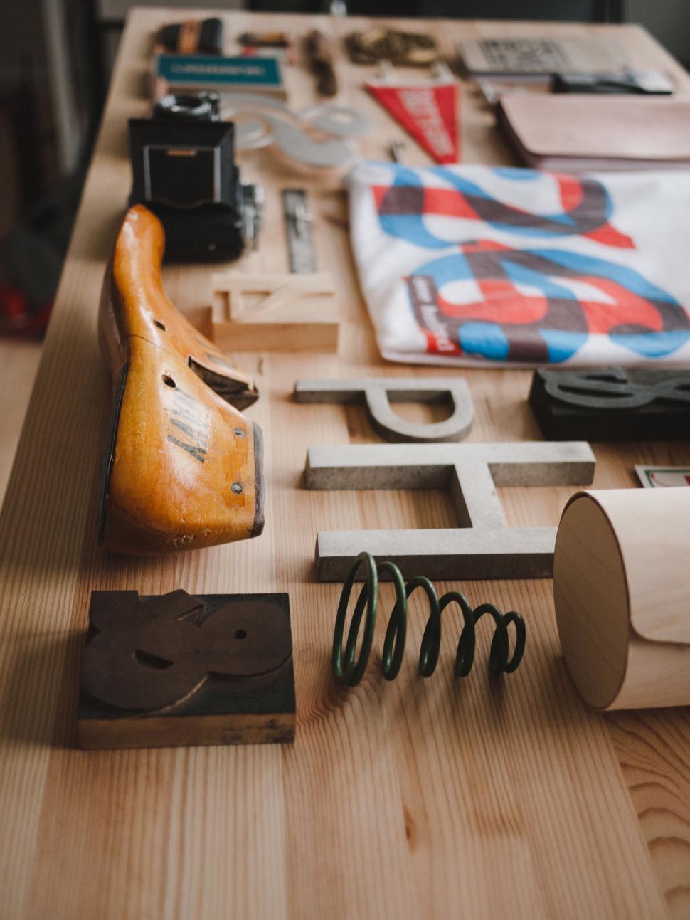 Free Image of Wooden Table Covered With Assorted Items 