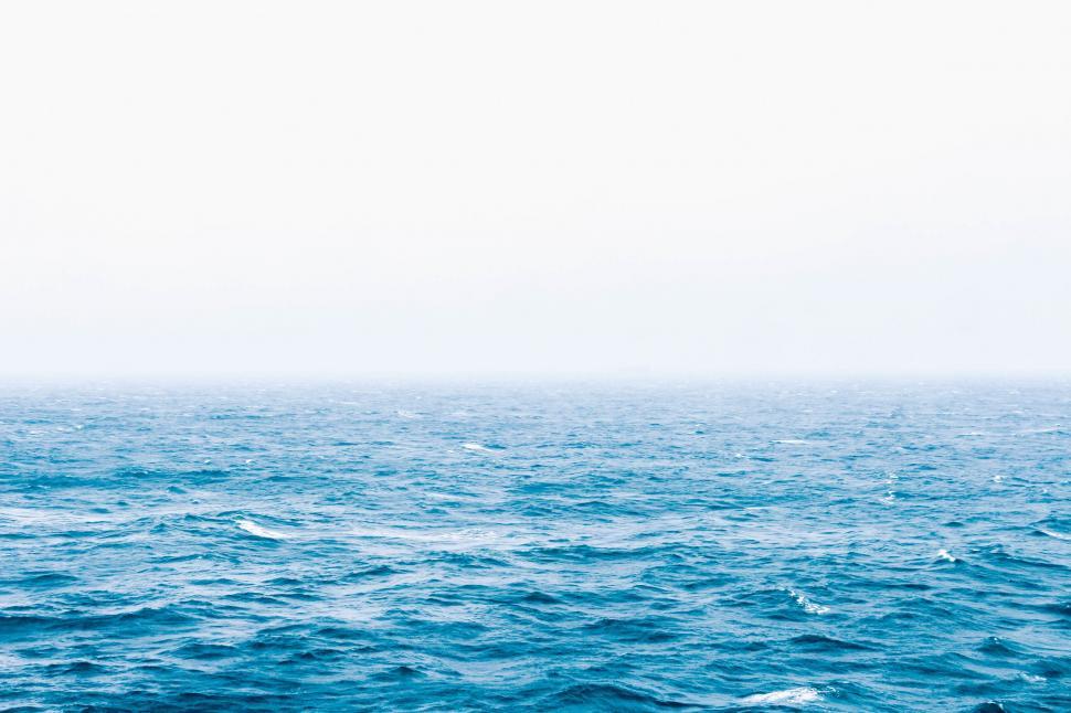 Free Image of Boat Sailing Across Vast Water 