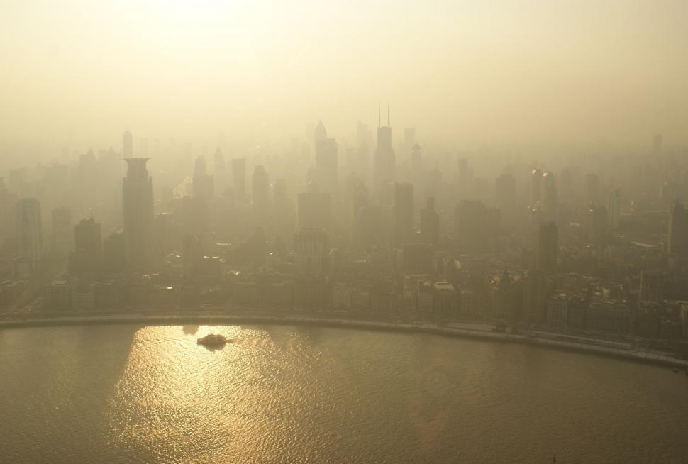 Free Image of Urban Cityscape Surrounding Large Body of Water 