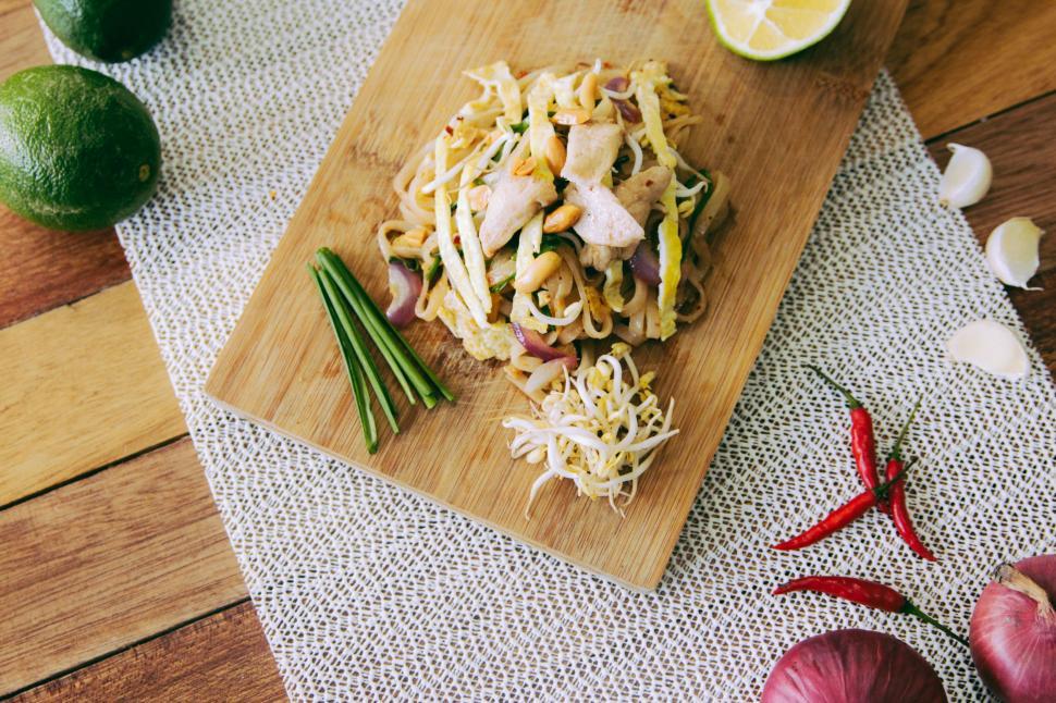 Free Image of Wooden Cutting Board With Pasta and Vegetables 
