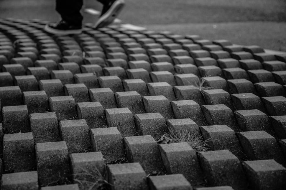 Free Image of Person Riding Skateboard on Brick Wall 