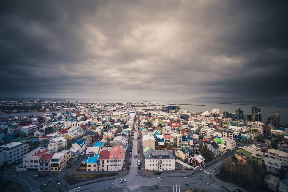 Free Image of Aerial View of City Under Cloudy Sky 