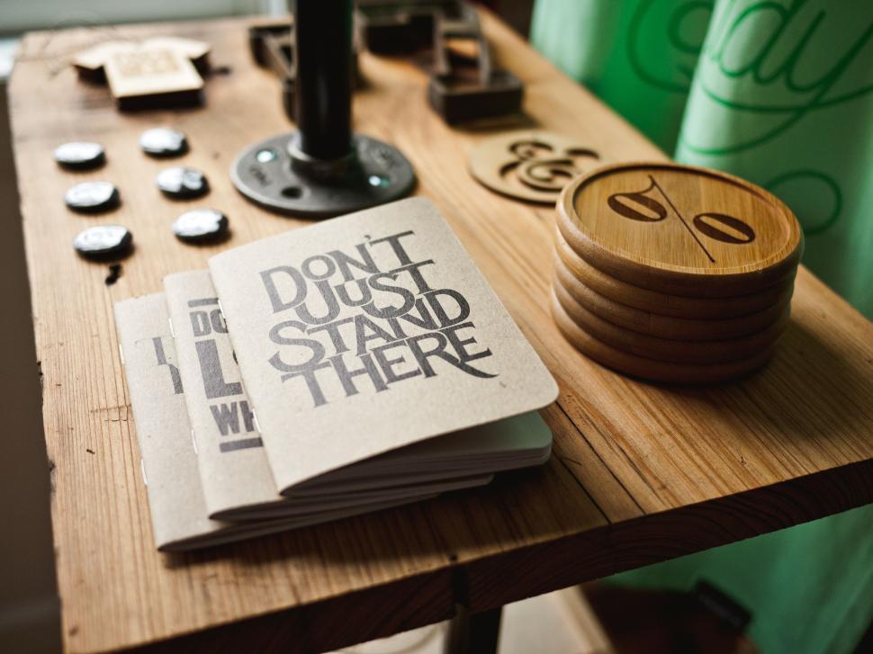 Free Image of Wooden Table Covered With Books 