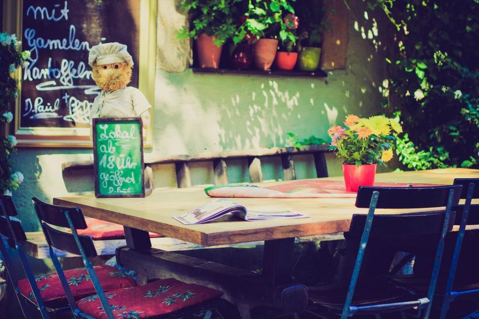 Free Image of Table With Chairs and Potted Plant 