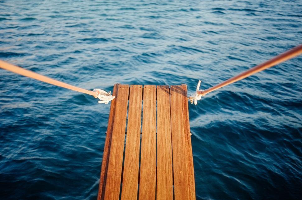 Free Image of Wooden Dock in the Middle of a Body of Water 