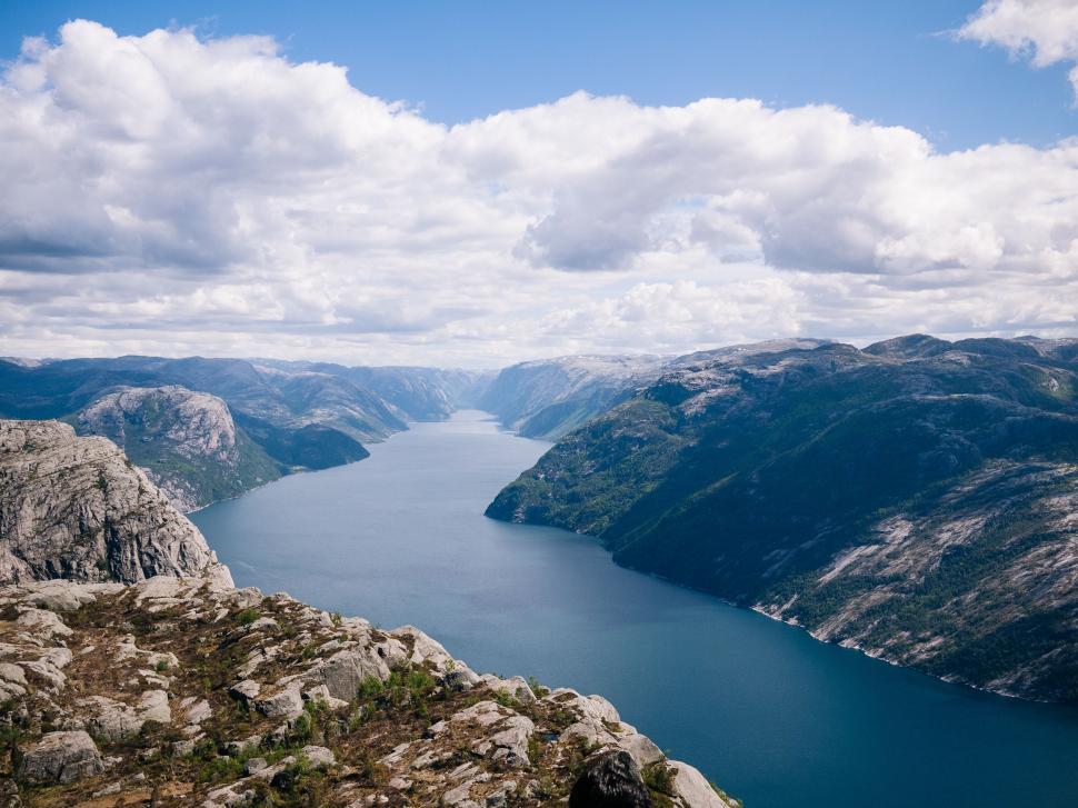 Free Image of Overlooking a Body of Water From a Cliff 