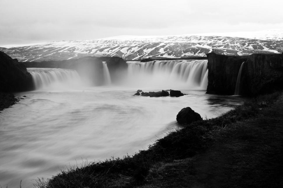 Free Image of Majestic Waterfall Cascading Down Rocks 