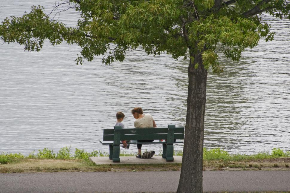 Free Image of Mother and Son sit by the river 