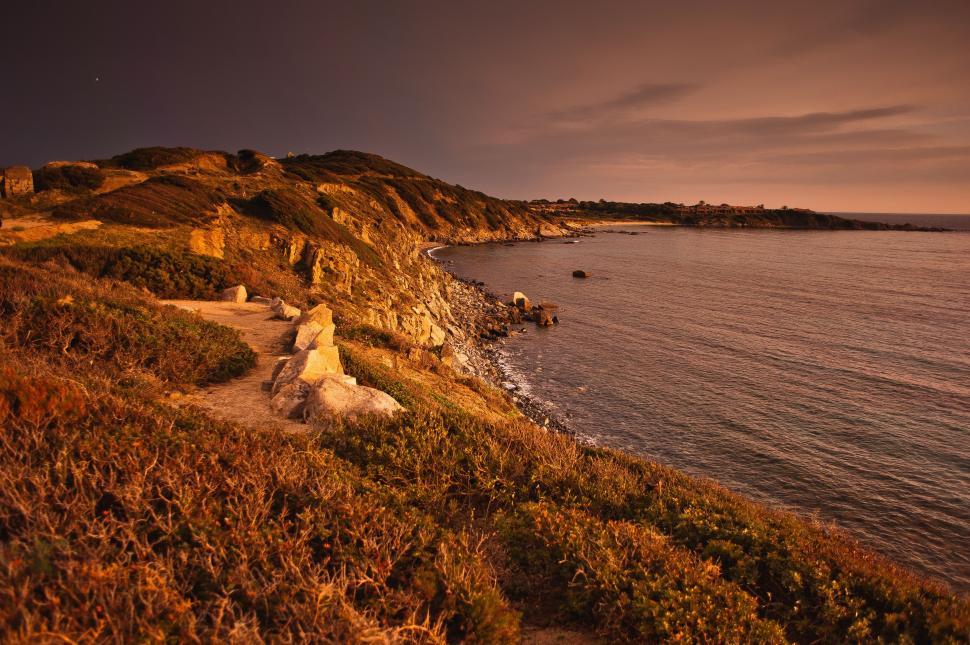 Free Image of Path Leading to Beach Alongside Body of Water 
